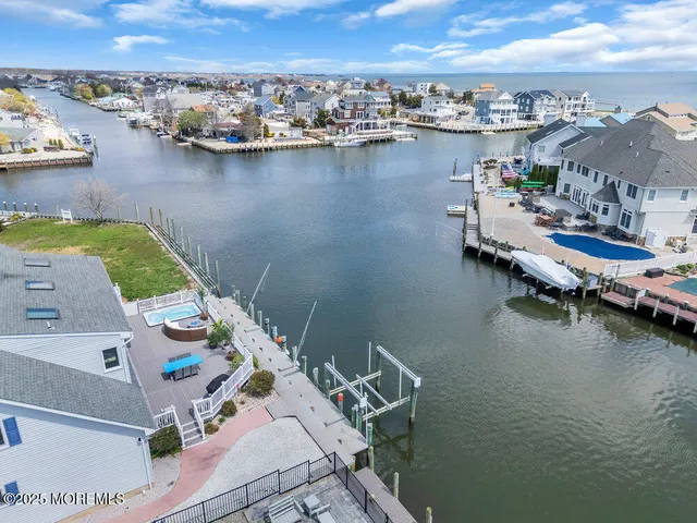 a view of a patio with lawn chairs next to a yard