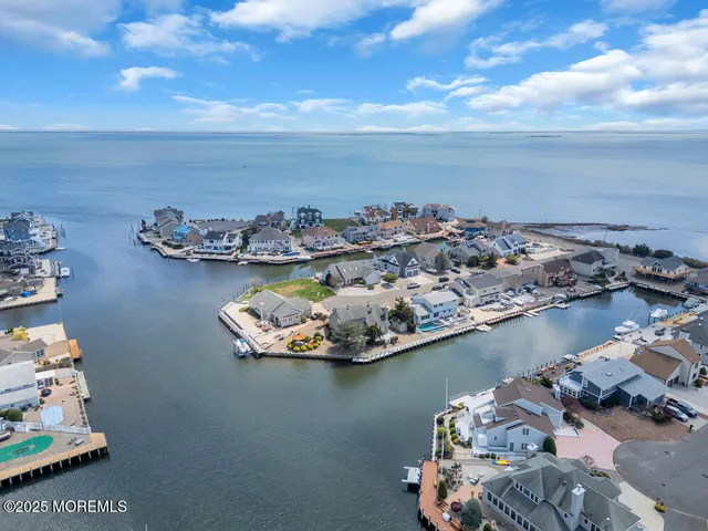 an aerial view of a residential house with outdoor space