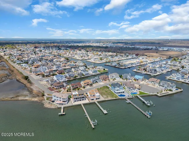 an aerial view of a city with lake view