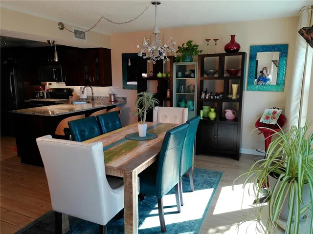a bedroom with bed and wooden floor