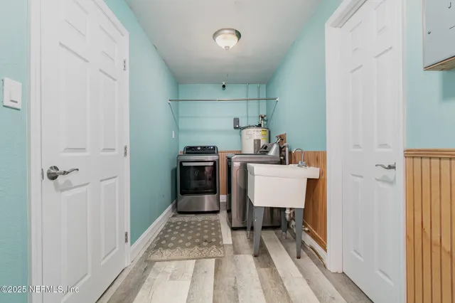 a view of a hallway with seating area and closet