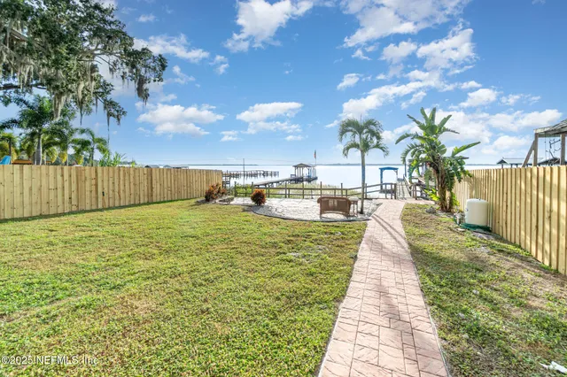 a swimming pool with wooden fence