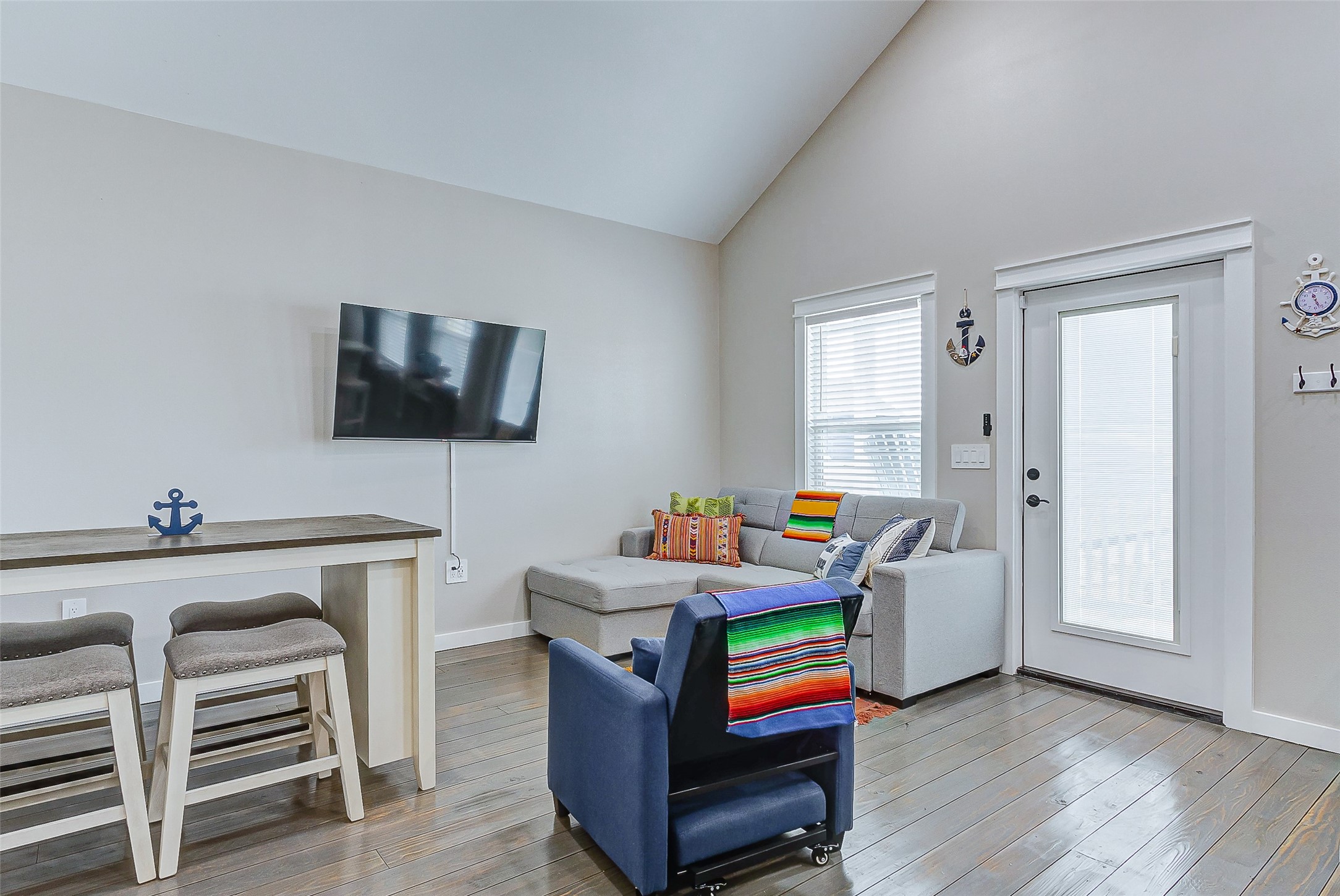 1052 Johnson Road Port Bolivar, TX 77650 - Photo 15 of 40 a room with furniture a flat screen tv and wooden floor