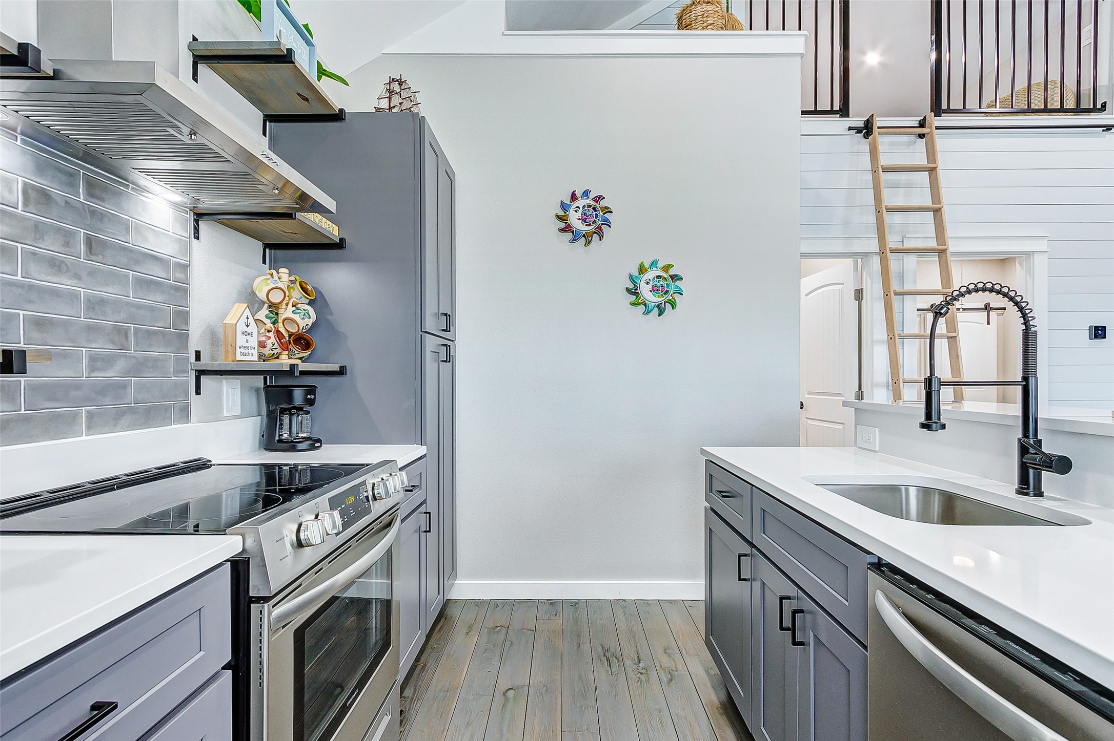 1052 Johnson Road Port Bolivar, TX 77650 - Photo 21 of 40 a kitchen with stainless steel appliances granite countertop a sink and a stove