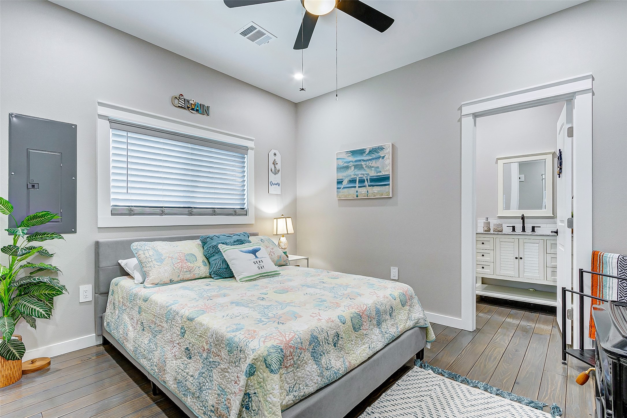 1052 Johnson Road Port Bolivar, TX 77650 - Photo 27 of 40 a bedroom with a large bed and a chandelier