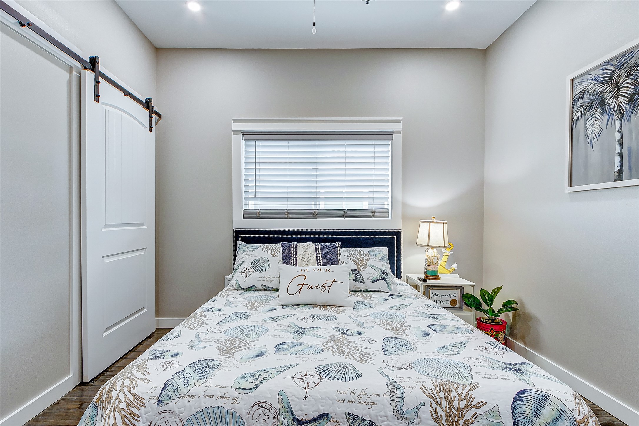 1052 Johnson Road Port Bolivar, TX 77650 - Photo 32 of 40 a bed sitting in a bedroom next to a window