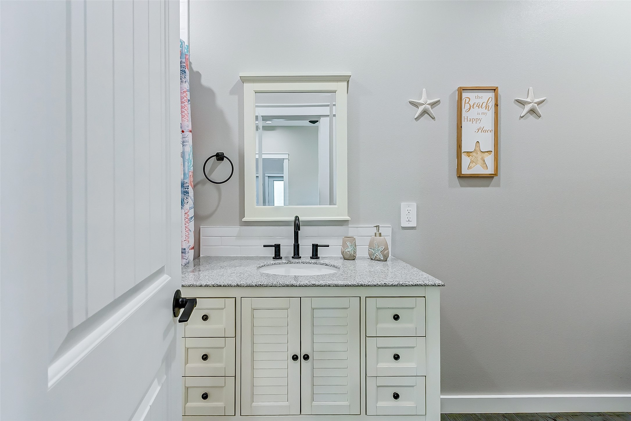 1052 Johnson Road Port Bolivar, TX 77650 - Photo 34 of 40 a bathroom with a sink vanity and a mirror