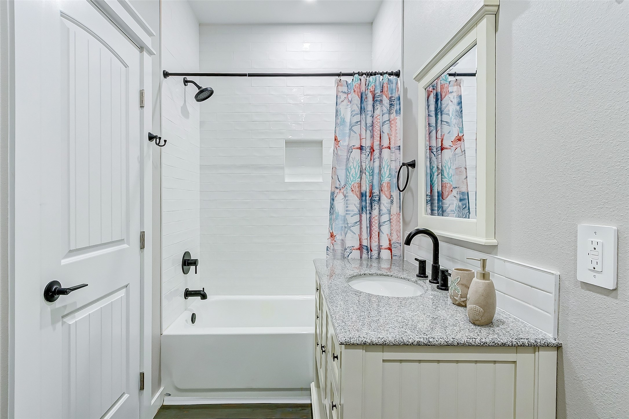 1052 Johnson Road Port Bolivar, TX 77650 - Photo 35 of 40 a bathroom with a granite countertop sink and a mirror