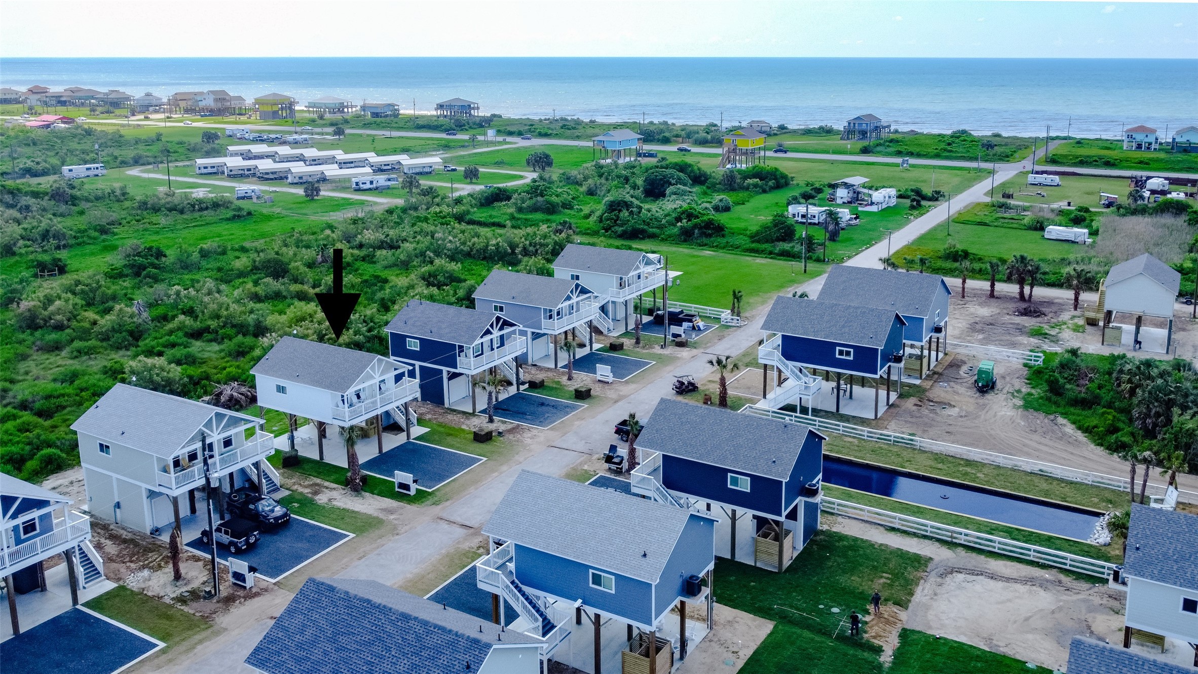 1052 Johnson Road Port Bolivar, TX 77650 - Photo 37 of 40 an aerial view of a house with garden space and outdoor seating