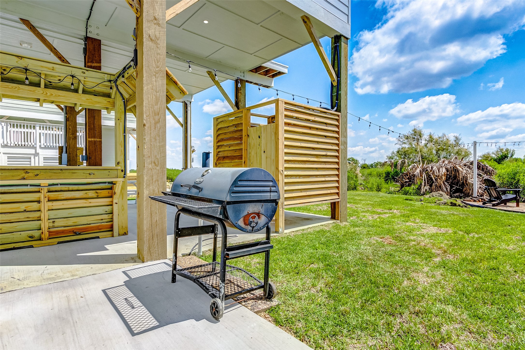 1052 Johnson Road Port Bolivar, TX 77650 - Photo 9 of 40 a backyard of a house with table and chairs