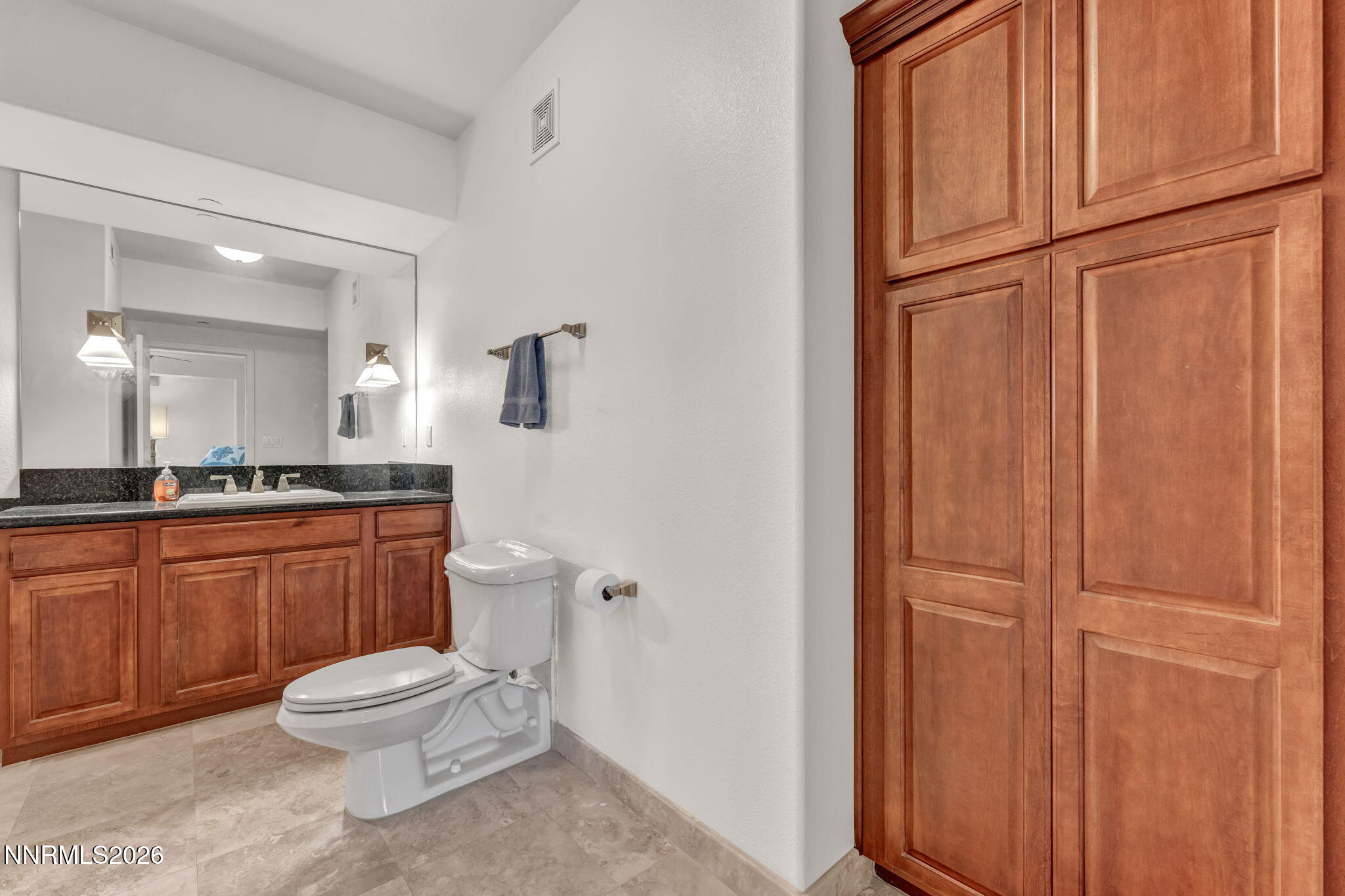 200 West 2nd Street, Unit 1103 Reno, NV 89501 - Photo 27 of 49 a bathroom with a toilet a sink and mirror