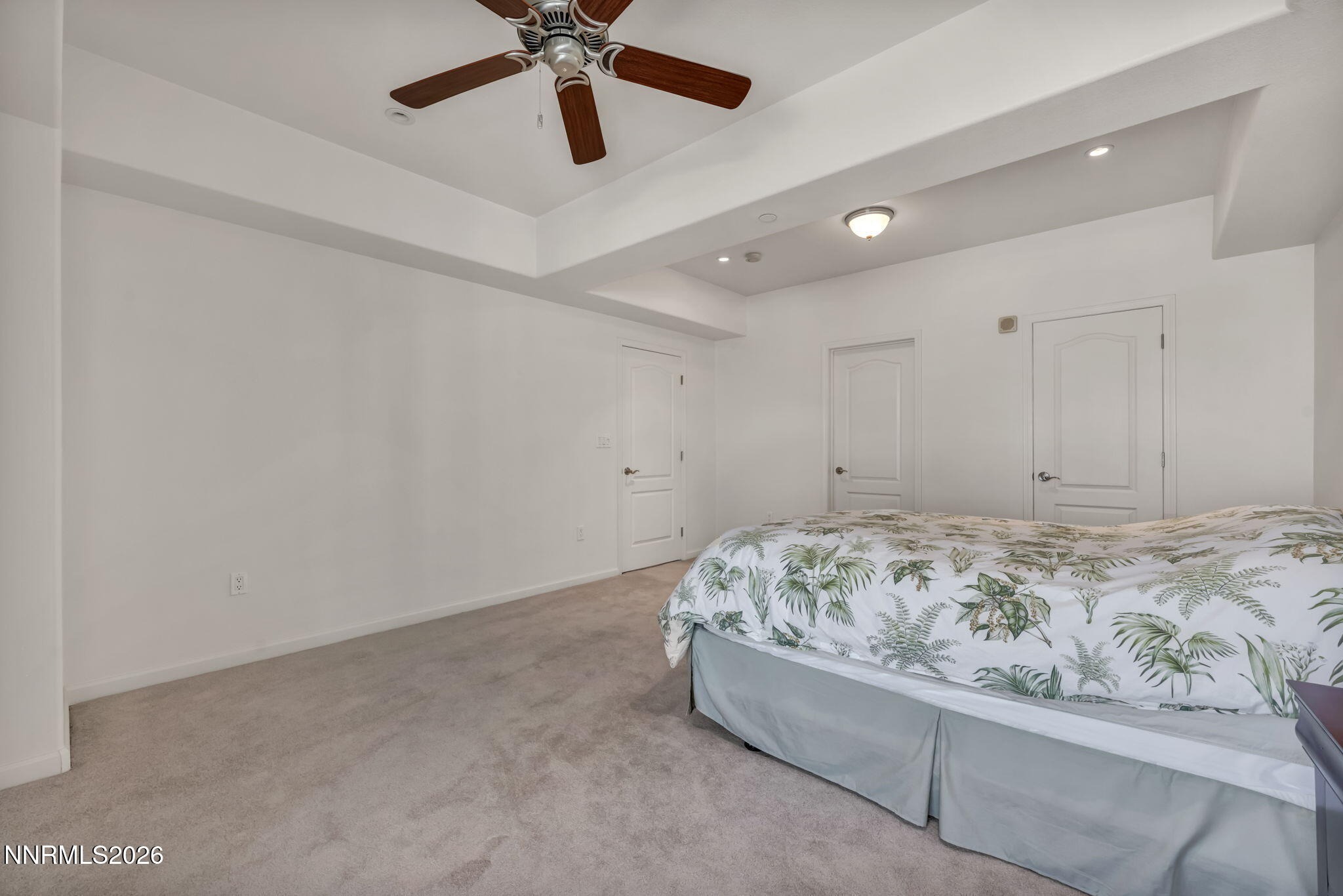 200 West 2nd Street, Unit 1103 Reno, NV 89501 - Photo 30 of 49 a bed room with a bed and a ceiling fan