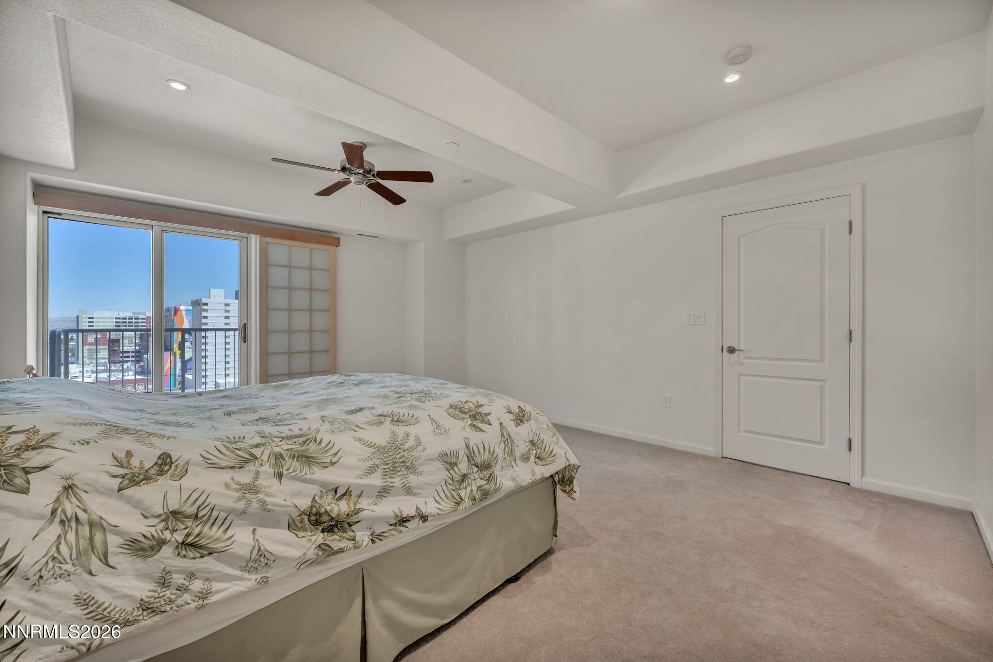 200 West 2nd Street, Unit 1103 Reno, NV 89501 - Photo 31 of 49 a bed room with a bed and a view of bedroom