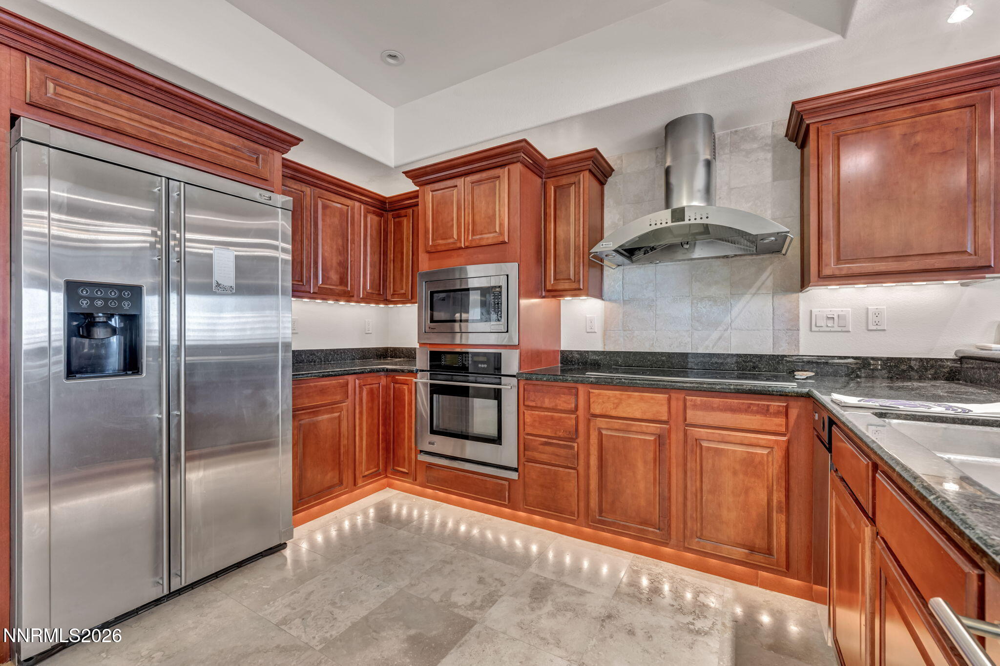 200 West 2nd Street, Unit 1103 Reno, NV 89501 - Photo 6 of 49 a kitchen with stainless steel appliances granite countertop a refrigerator and a stove