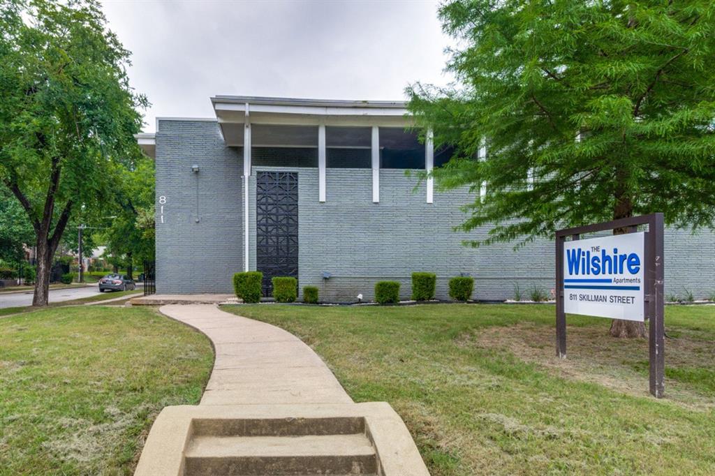 811 Skillman Street, Unit 105 Dallas, TX 75214 - Photo 6 of 13 a view of a house with a yard and fence