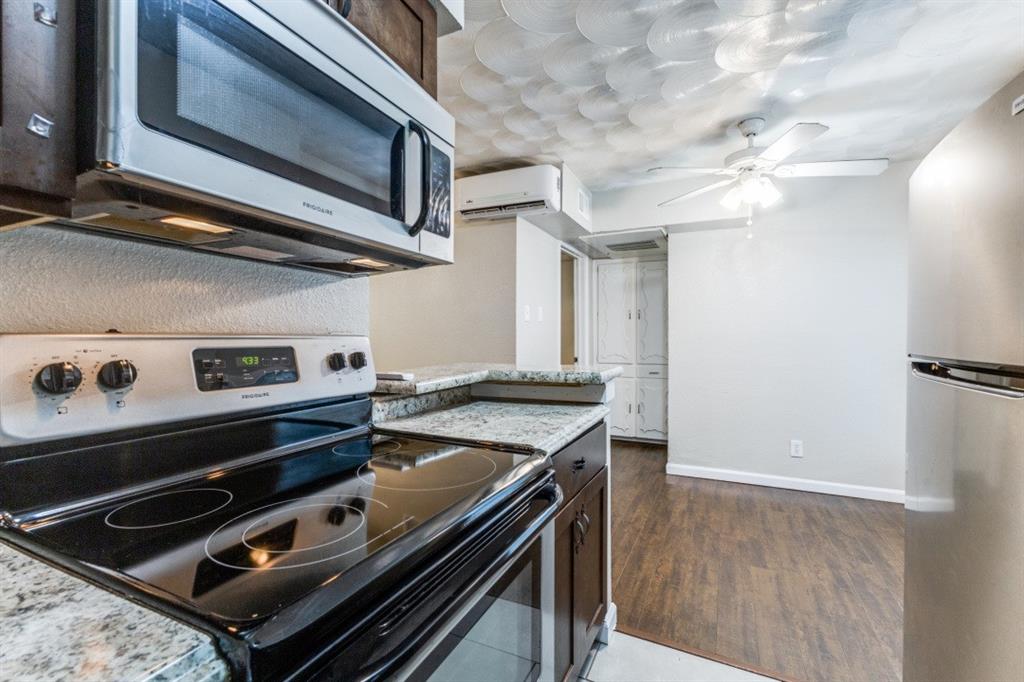 811 Skillman Street, Unit 105 Dallas, TX 75214 - Photo 10 of 13 a kitchen with a stove and a microwave