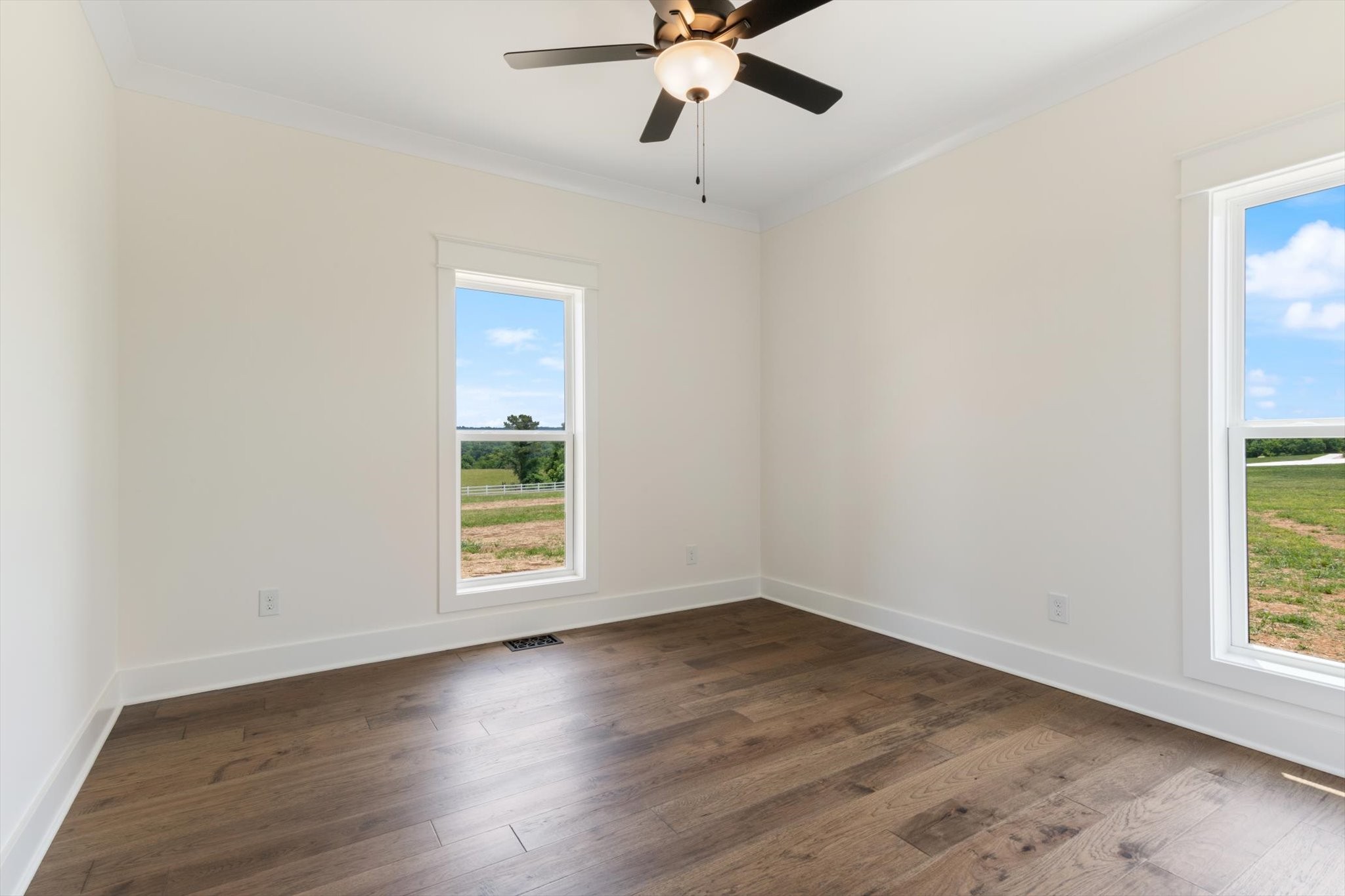 926 Cortner Road Normandy, TN 37360 - Photo 51 of 59 an empty room with wooden floor fan and windows