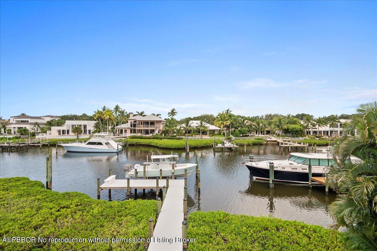 159 Commodore Drive Jupiter, FL 33477 - Photo 12 of 20 a view of a lake with houses