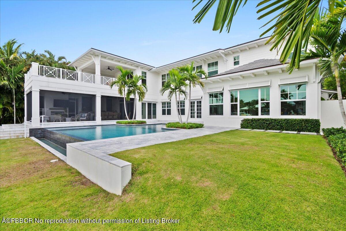 159 Commodore Drive Jupiter, FL 33477 - Photo 13 of 20 a view of a building with a swimming pool