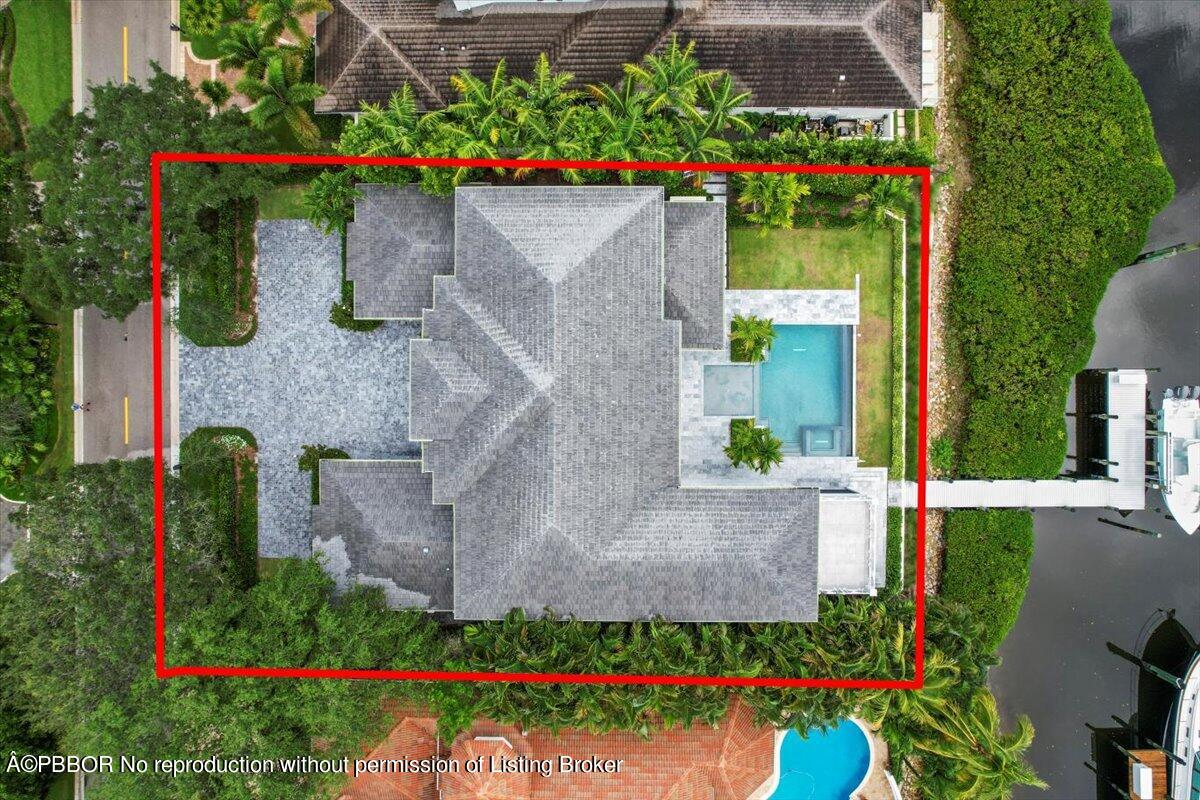 159 Commodore Drive Jupiter, FL 33477 - Photo 19 of 20 an aerial view of a house with a yard and fountain