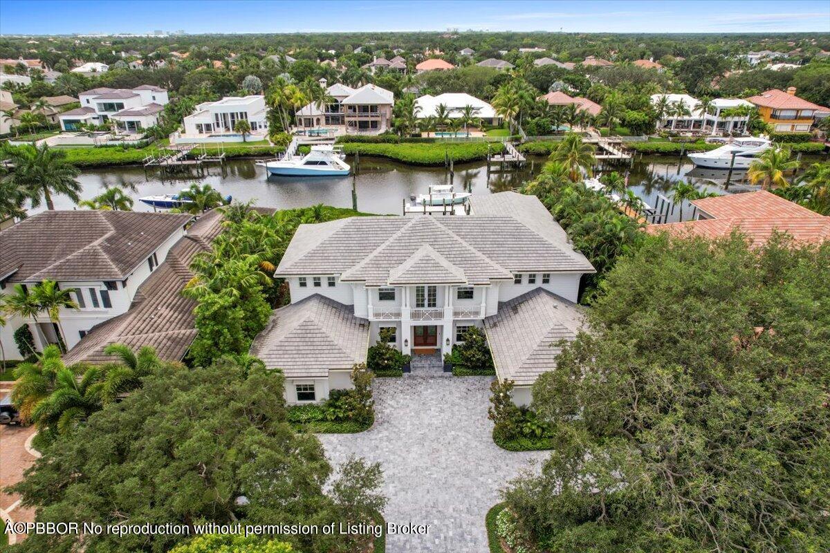 159 Commodore Drive Jupiter, FL 33477 - Photo 20 of 20 an aerial view of a house with a garden view