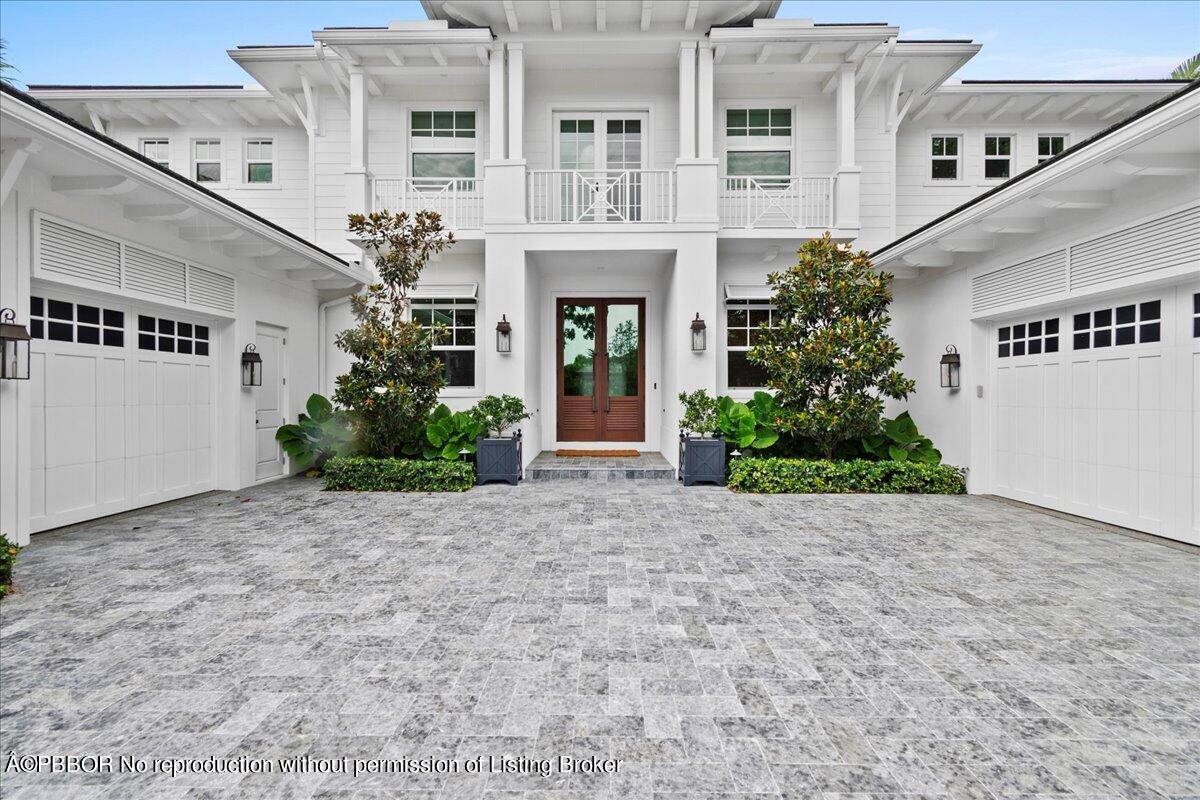 159 Commodore Drive Jupiter, FL 33477 - Photo 2 of 20 a view of a building with potted plants