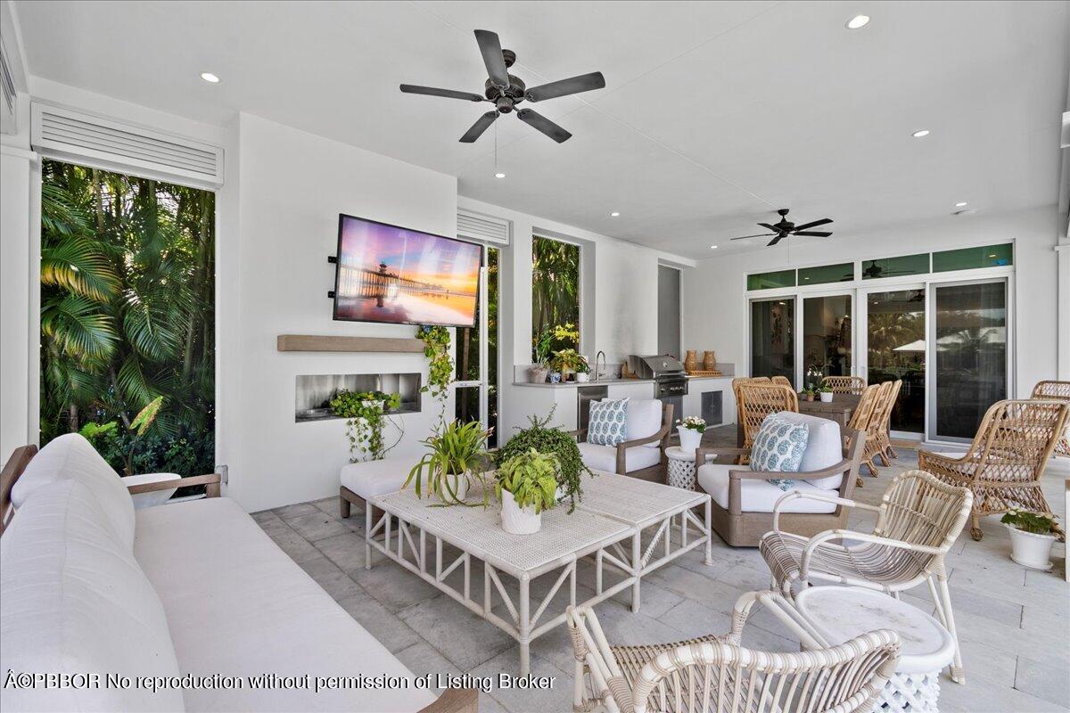 159 Commodore Drive Jupiter, FL 33477 - Photo 5 of 20 a living room with fireplace furniture and a large window