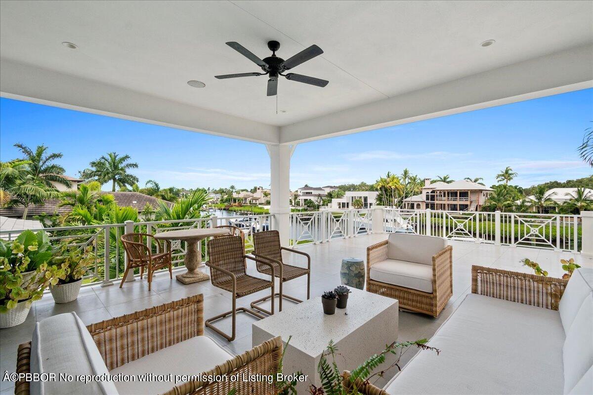 159 Commodore Drive Jupiter, FL 33477 - Photo 7 of 20 a view of a livingroom with furniture and a ceiling fan