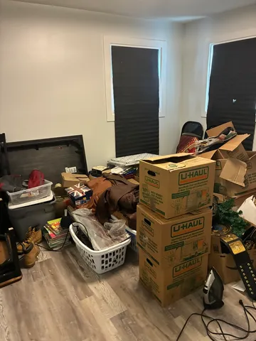 a bed room with a bed and a window