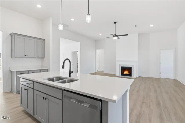 a kitchen with a sink and a fireplace