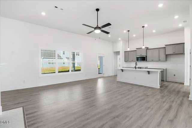 a large kitchen with stainless steel appliances kitchen island a large island in the center
