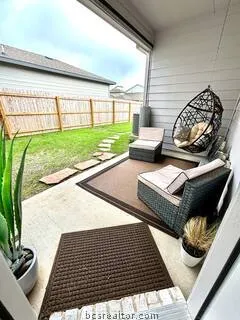 a view of a backyard with sitting area