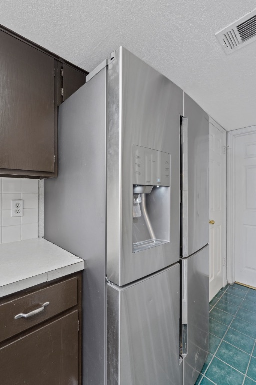9203 Kempler Drive, Unit B Austin, TX 78748 - Photo 13 of 26 a view of a kitchen with a closet and electronic appliances