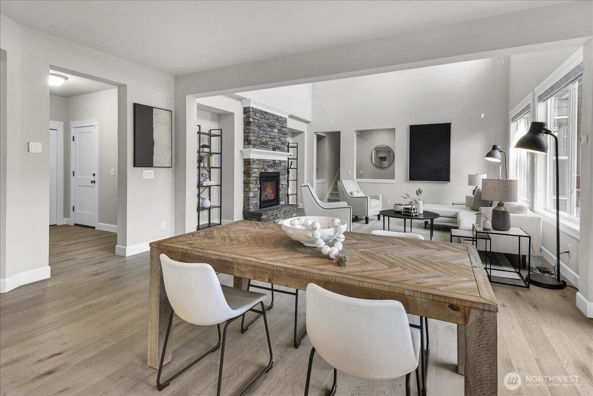 1434 241st Place Southeast Bothell, WA 98021 - Photo 11 of 40 a dining room with furniture and wooden floor