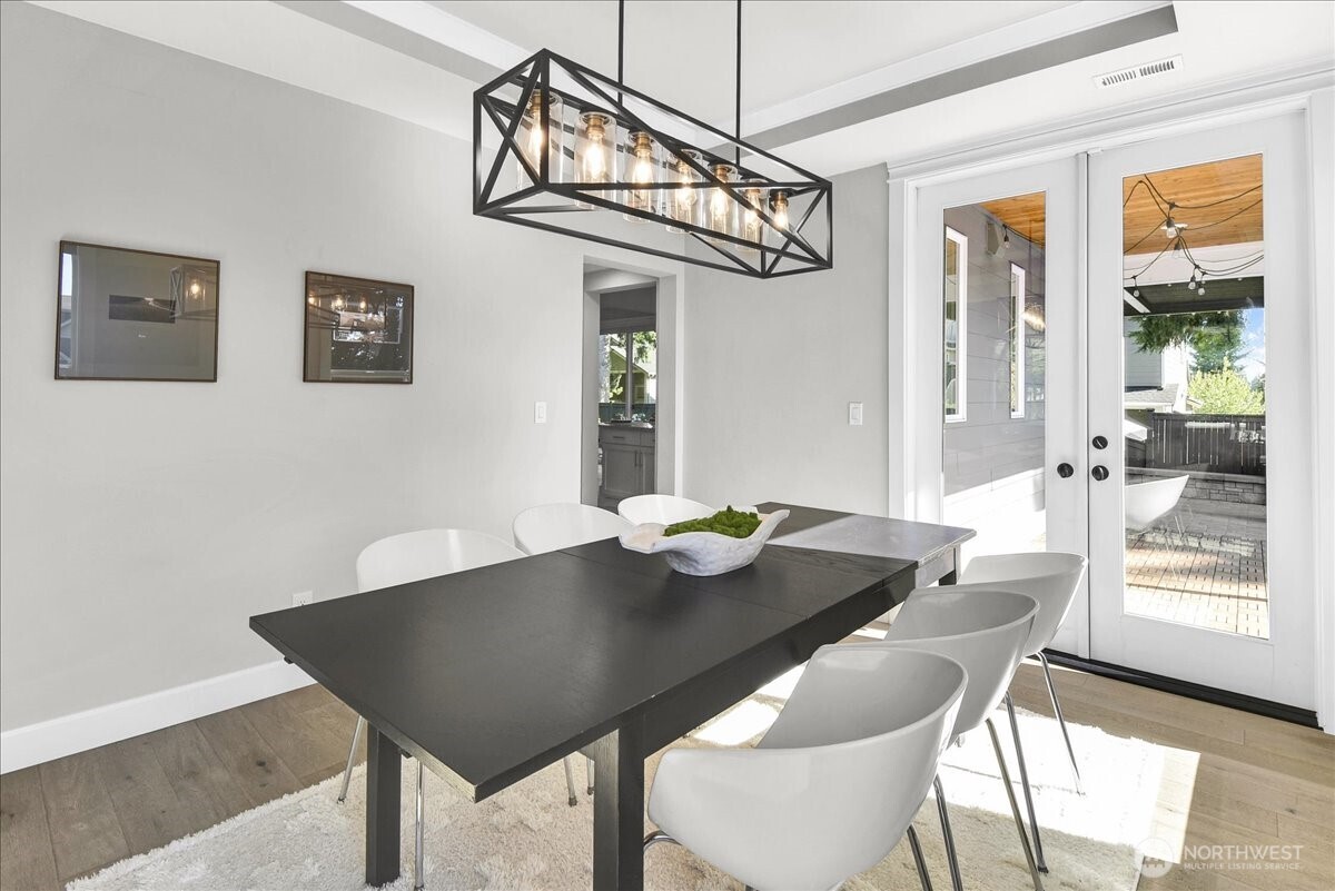1434 241st Place Southeast Bothell, WA 98021 - Photo 6 of 40 a view of a dining room with furniture wooden floor and chandelier