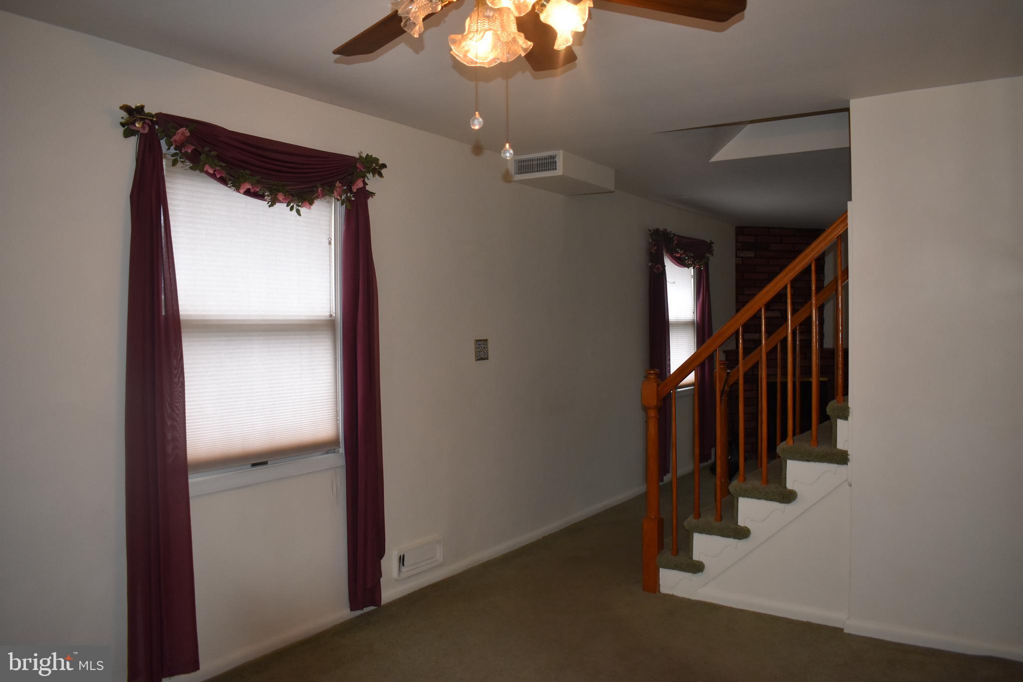 1753 Stokesley Road Baltimore, MD 21222 - Photo 11 of 33 Hardwood under carpet