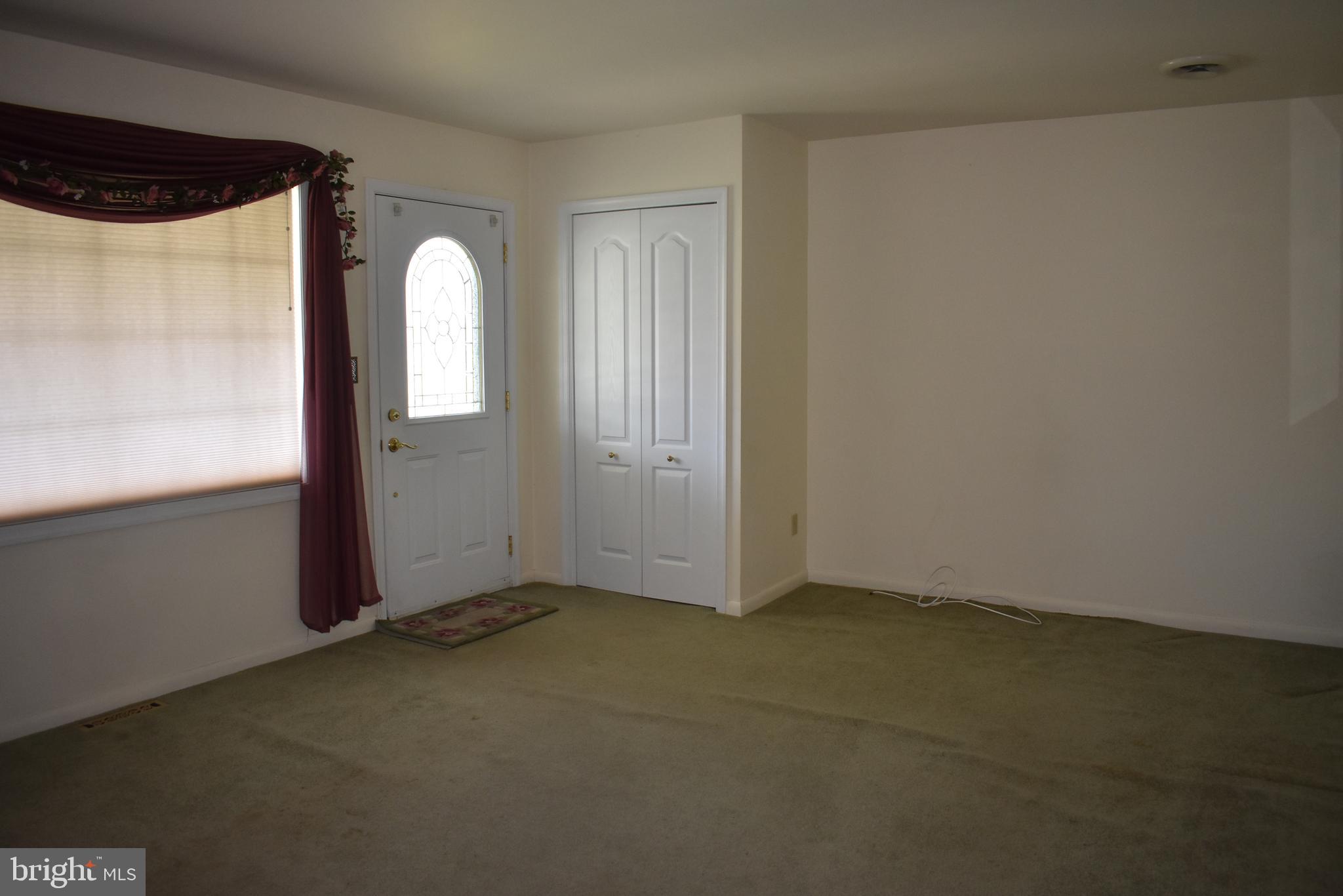 1753 Stokesley Road Baltimore, MD 21222 - Photo 6 of 33 Hardwood under carpet