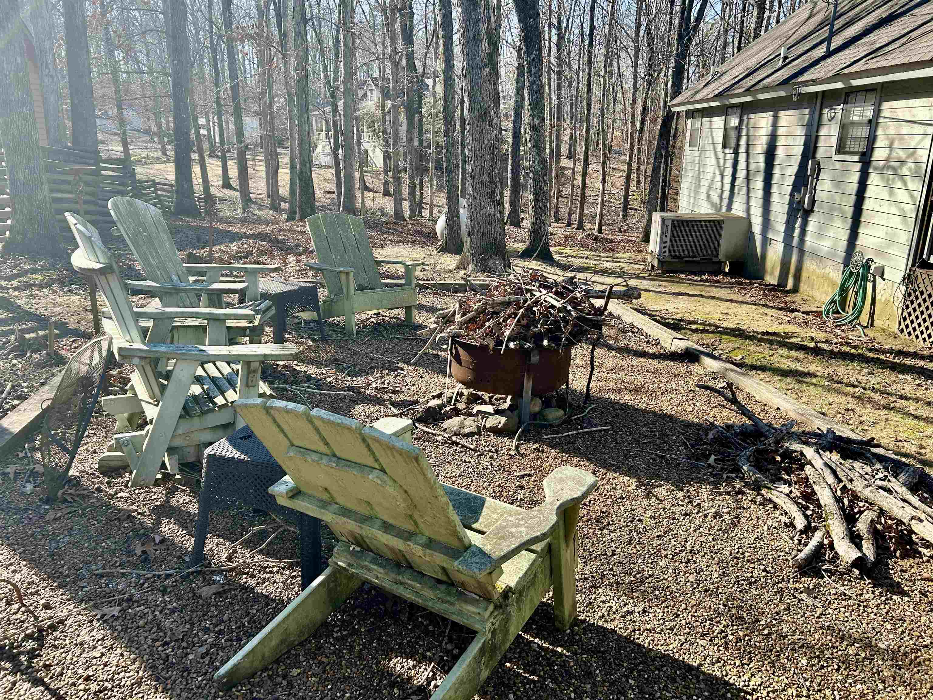 95 Blade Bay, Unit BAY Counce, TN 38326 - Photo 19 of 21 a view of a chairs and fire pit in backyard