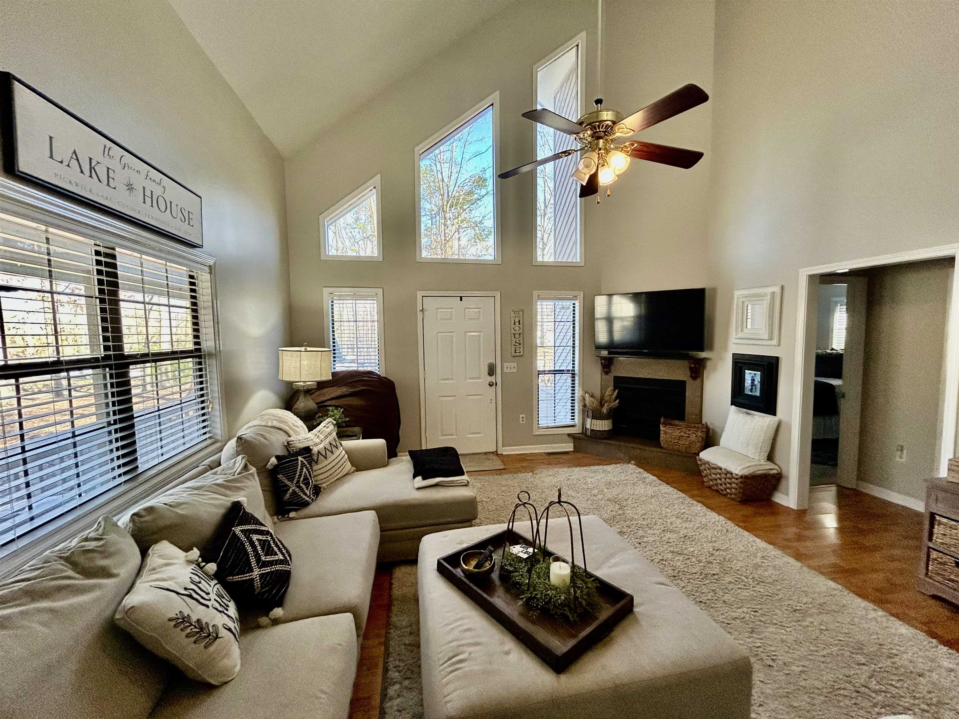 95 Blade Bay, Unit BAY Counce, TN 38326 - Photo 2 of 21 a living room with furniture floor to ceiling window and a flat screen tv