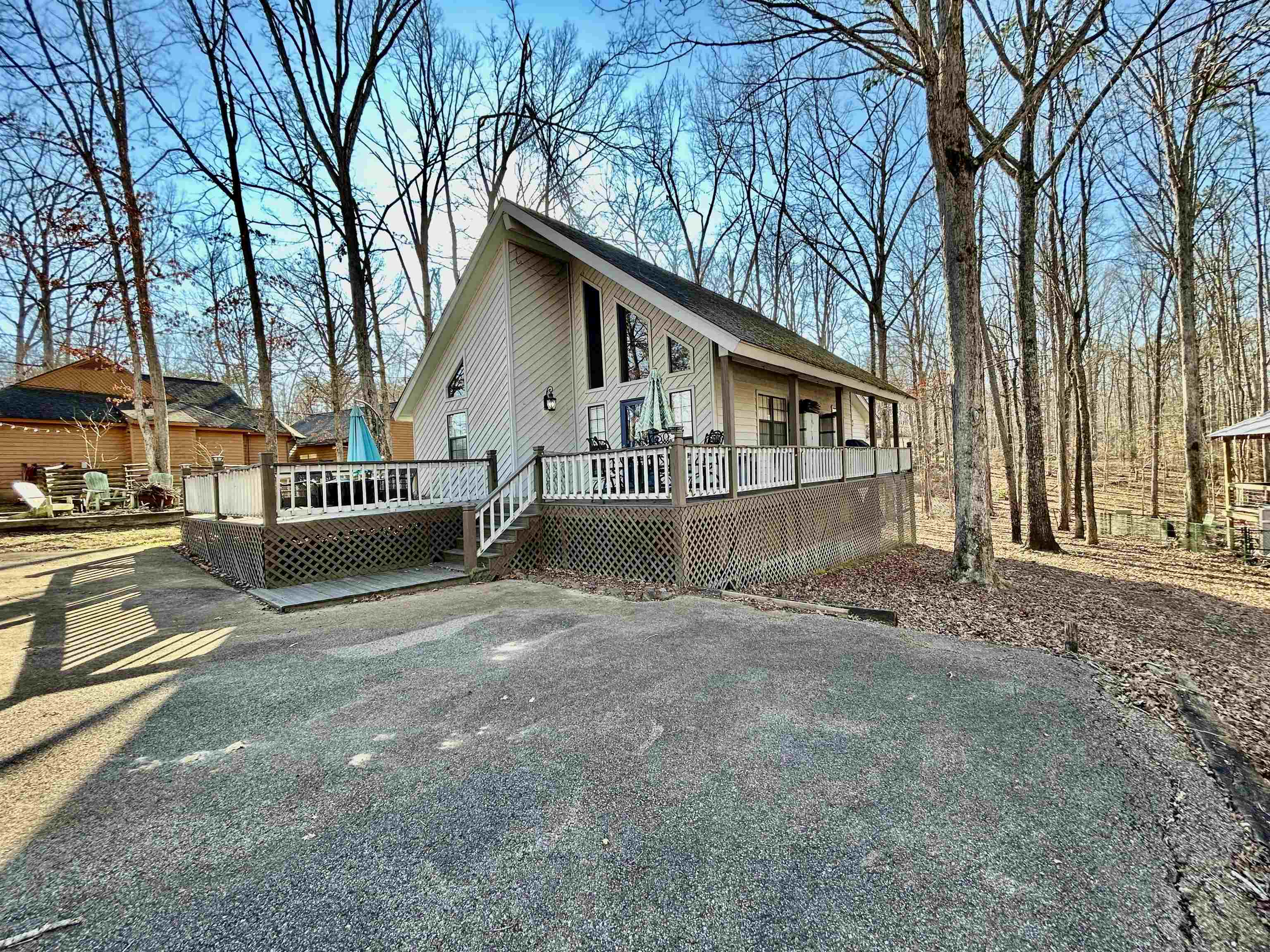 95 Blade Bay, Unit BAY Counce, TN 38326 - Photo 21 of 21 a view of a house with a yard and wooden fence