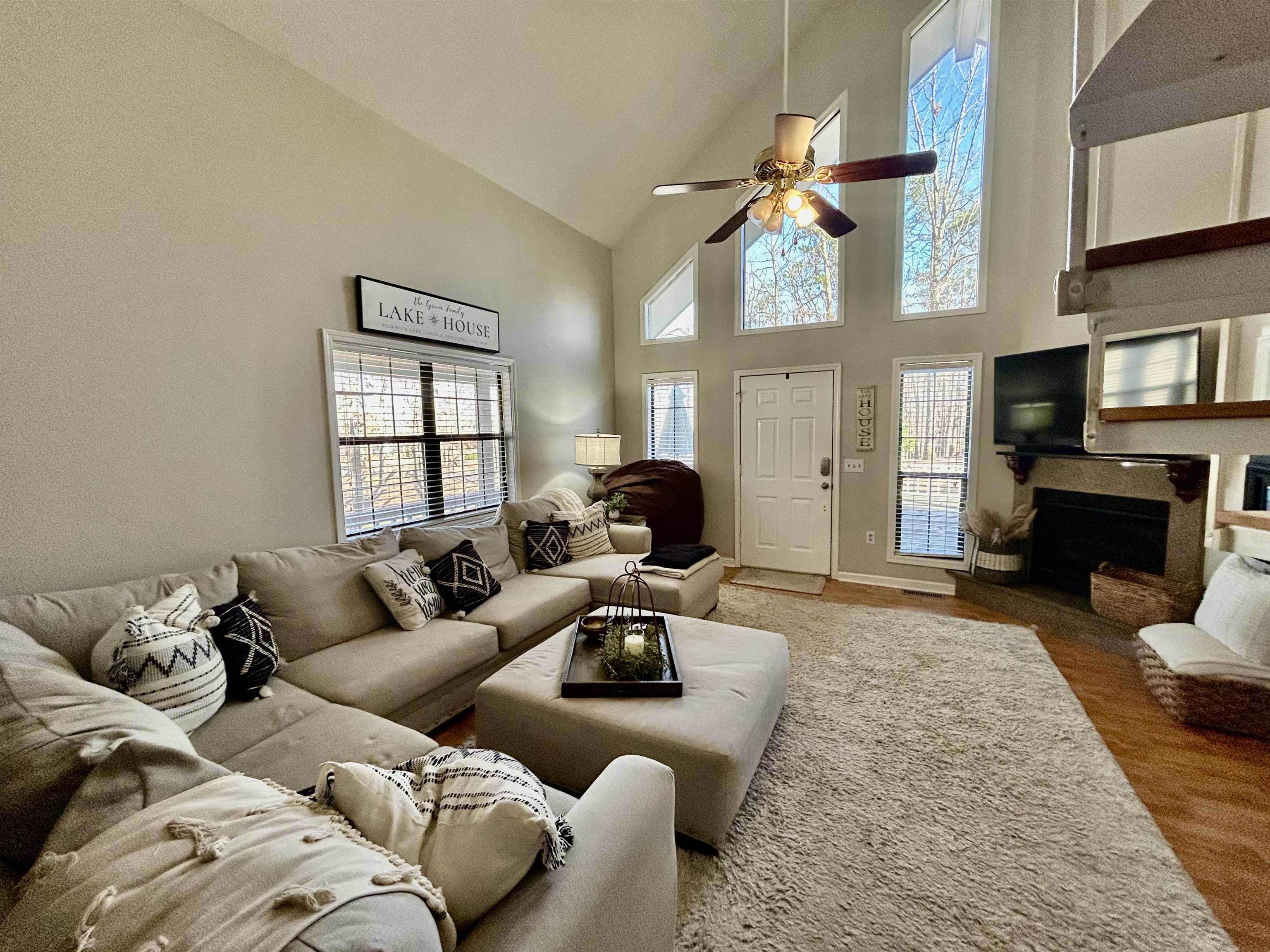 95 Blade Bay, Unit BAY Counce, TN 38326 - Photo 3 of 21 a living room with furniture a fireplace and a flat screen tv