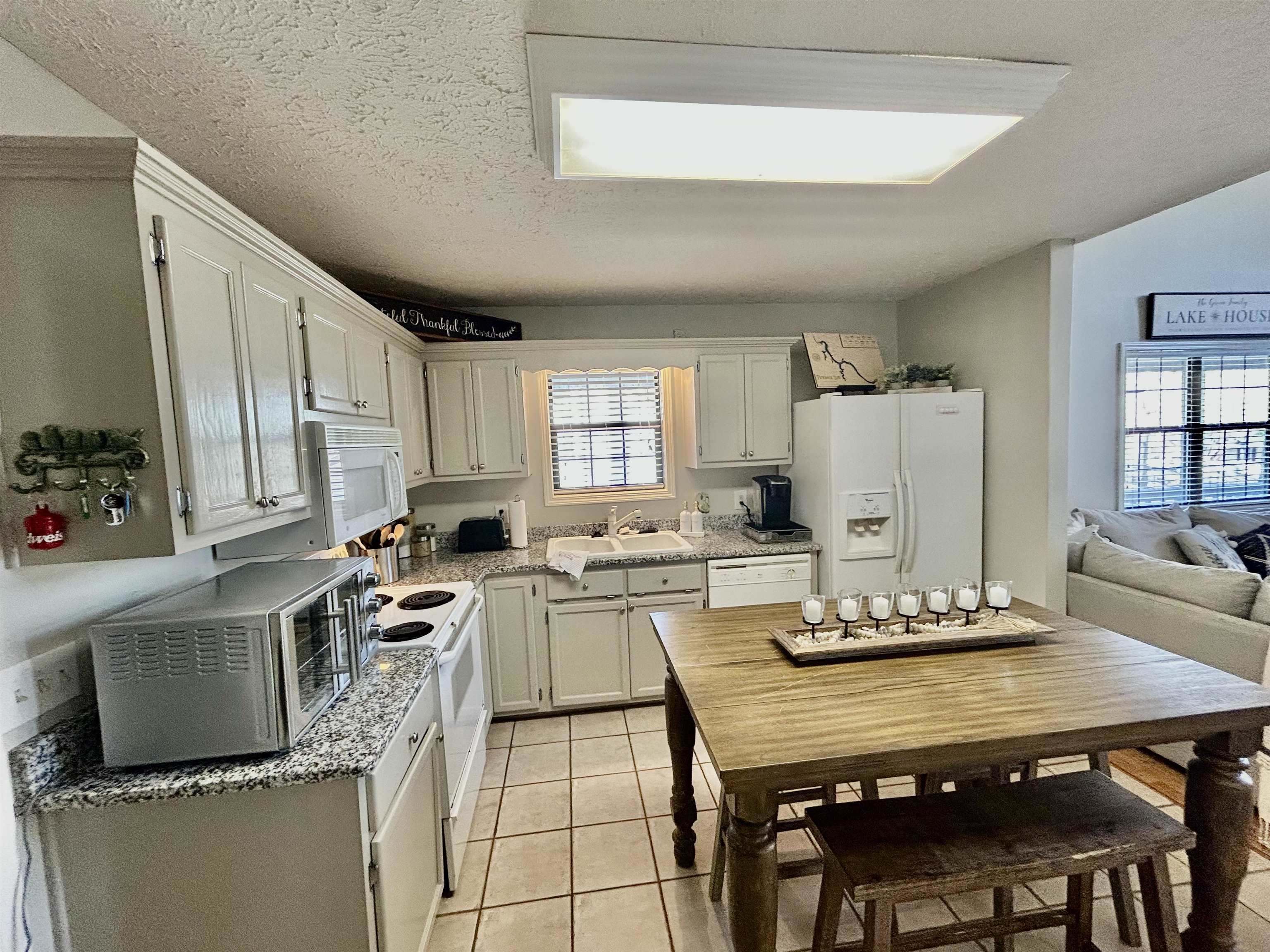 95 Blade Bay, Unit BAY Counce, TN 38326 - Photo 5 of 21 a kitchen with a dining table chairs and refrigerator