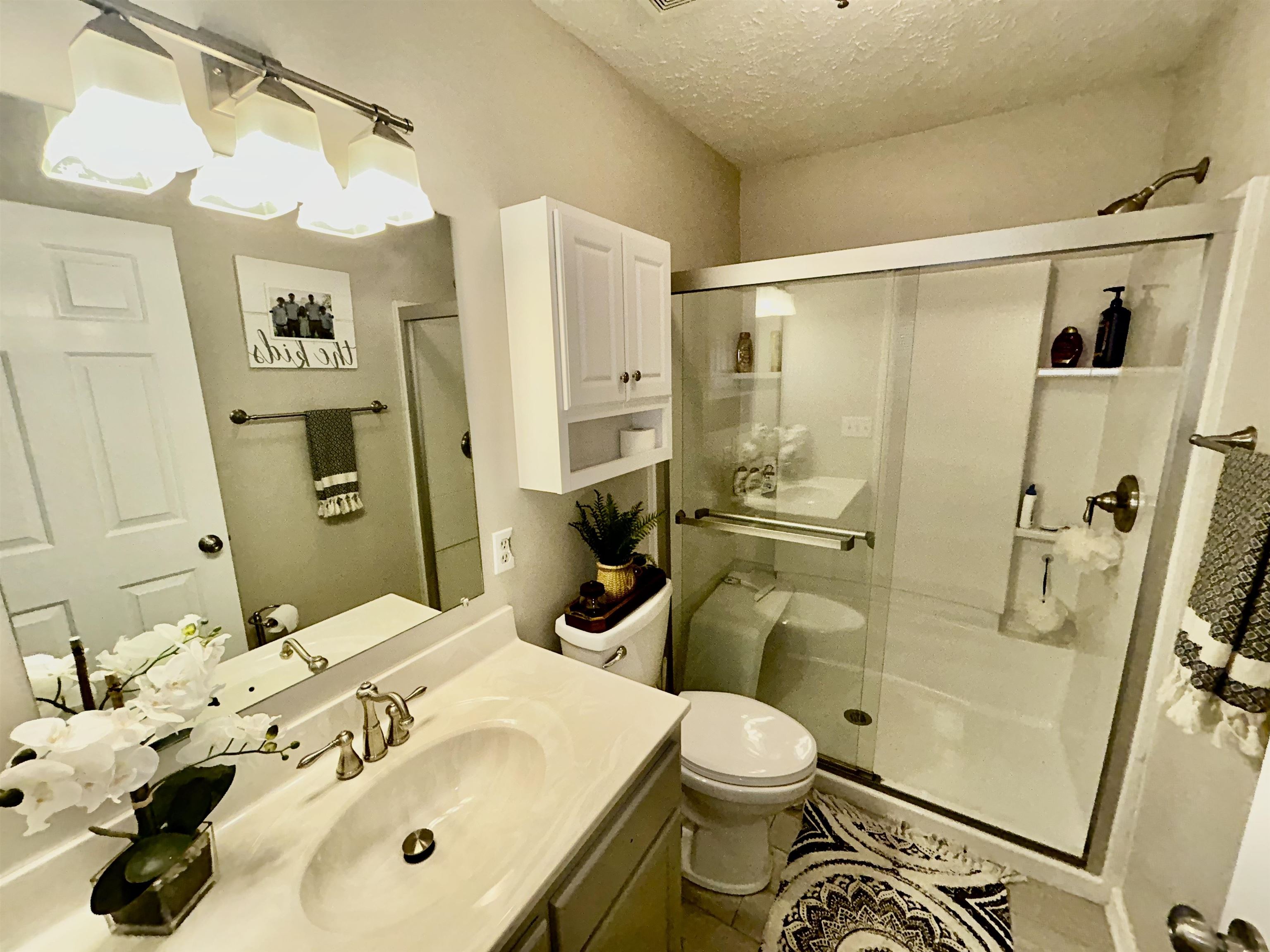 95 Blade Bay, Unit BAY Counce, TN 38326 - Photo 9 of 21 a bathroom with a sink toilet and shower