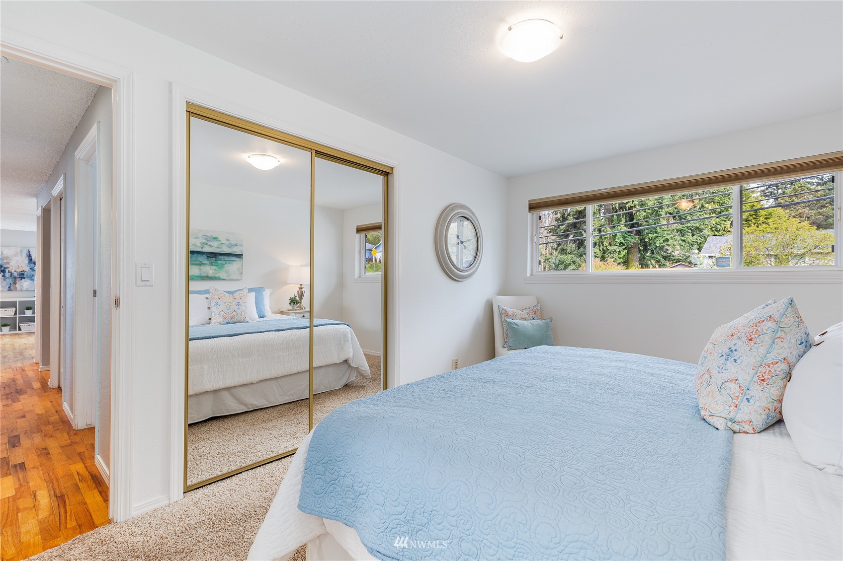 504 240th Street Southwest Bothell, WA 98021 - Photo 12 of 40 a bedroom with a large bed and a window