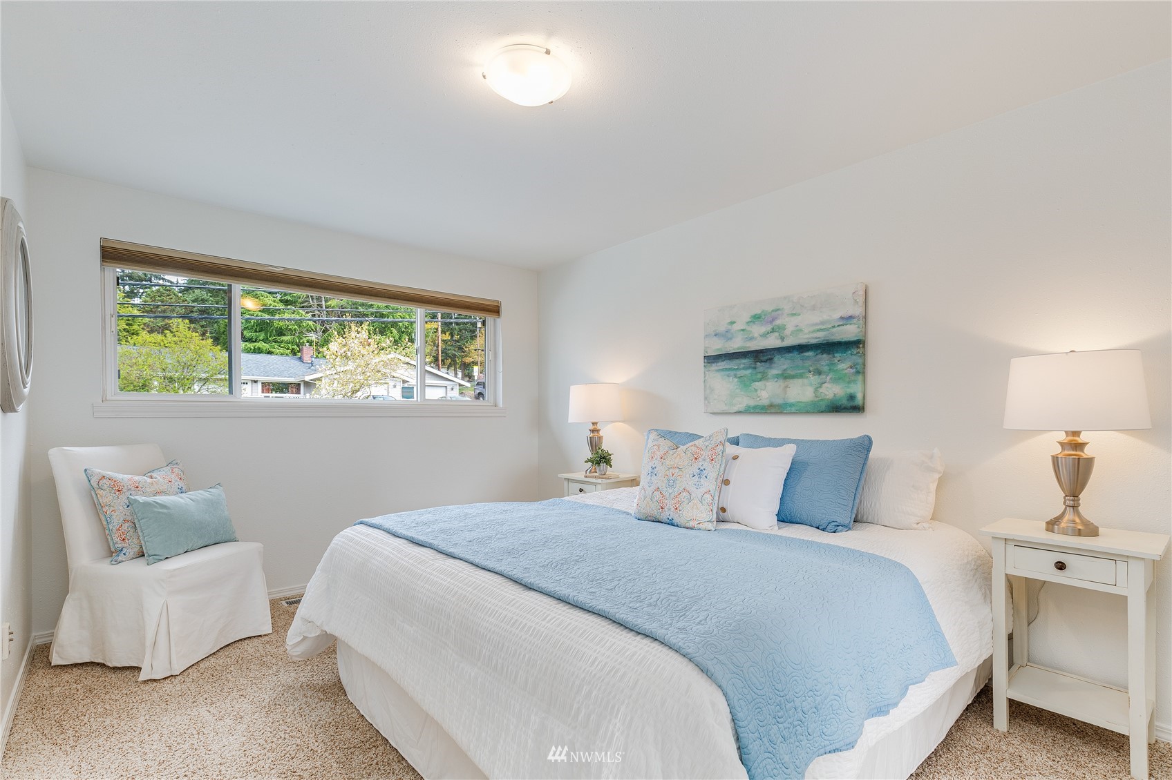 504 240th Street Southwest Bothell, WA 98021 - Photo 13 of 40 a bedroom with a large bed and a window
