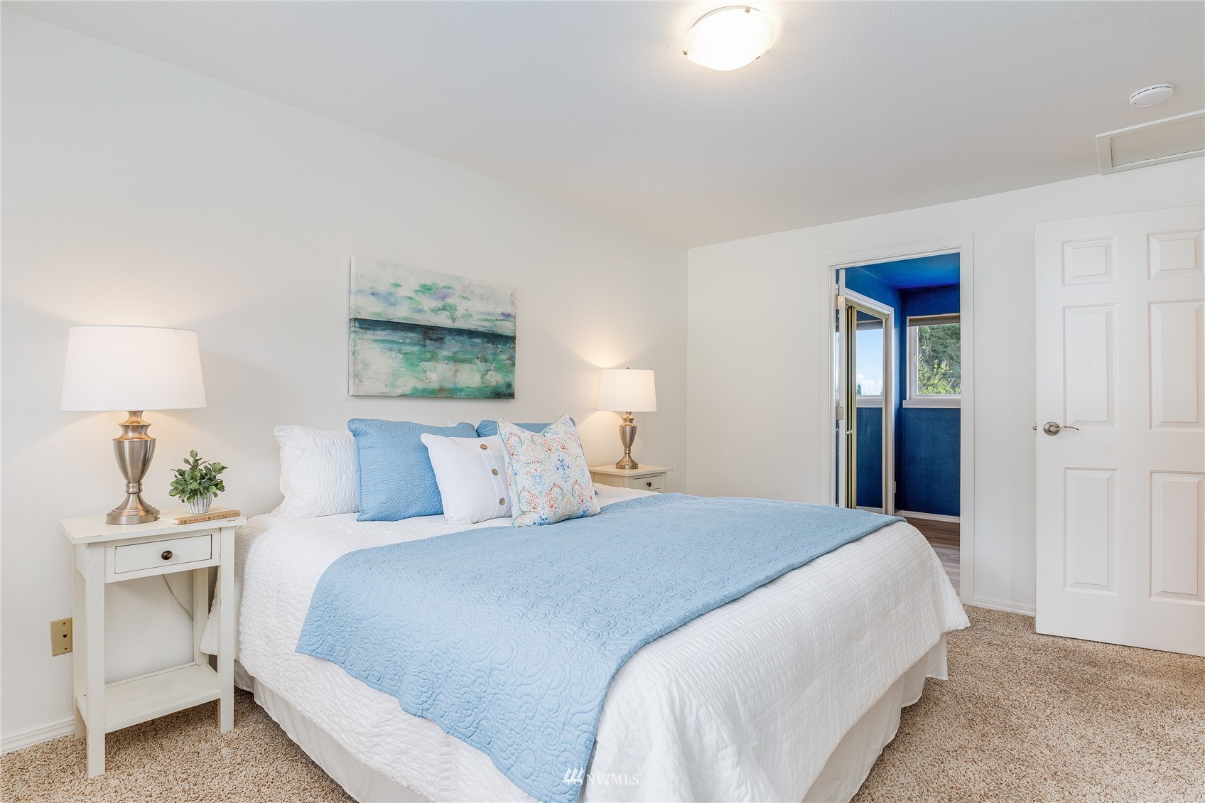 504 240th Street Southwest Bothell, WA 98021 - Photo 14 of 40 a bedroom with a bed and a lamp