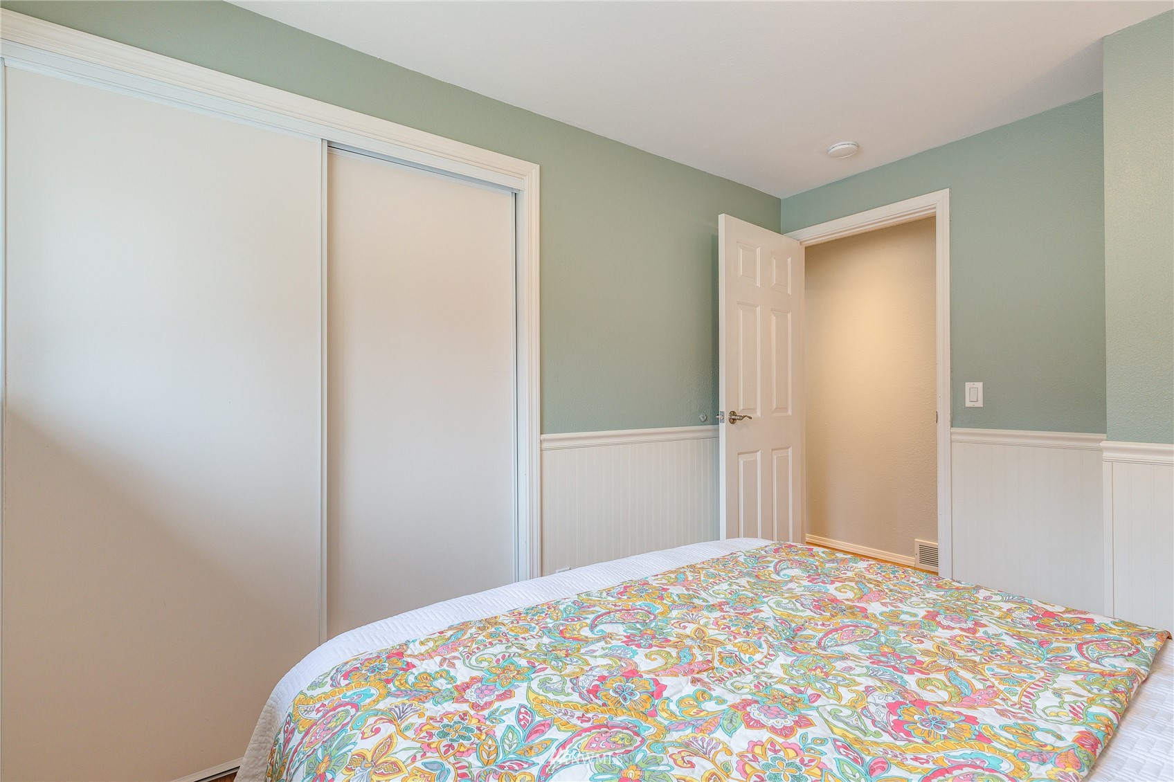 504 240th Street Southwest Bothell, WA 98021 - Photo 18 of 40 a bedroom with a bed and a lamp