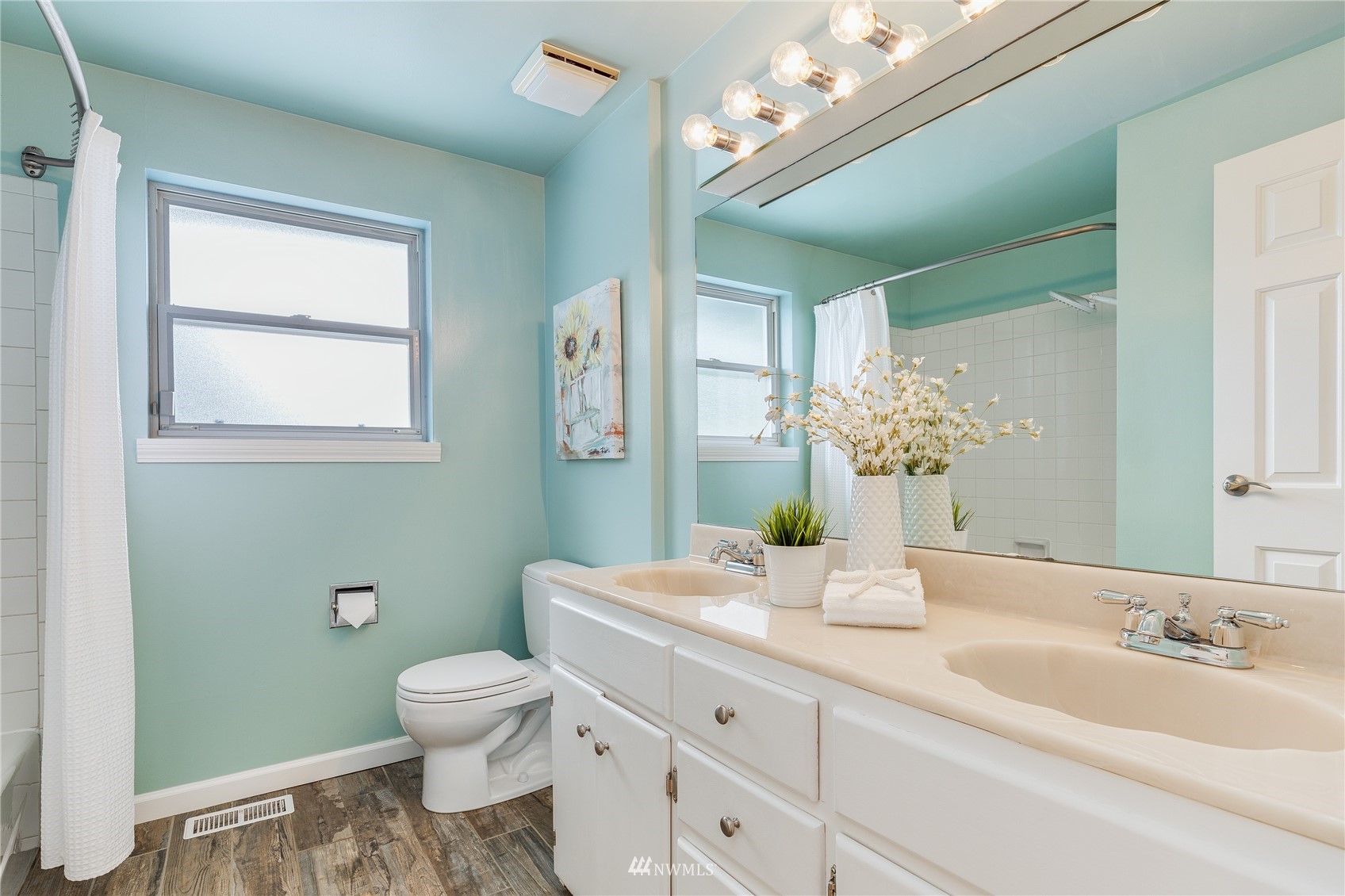 504 240th Street Southwest Bothell, WA 98021 - Photo 19 of 40 a bathroom with a granite countertop sink a toilet and a mirror
