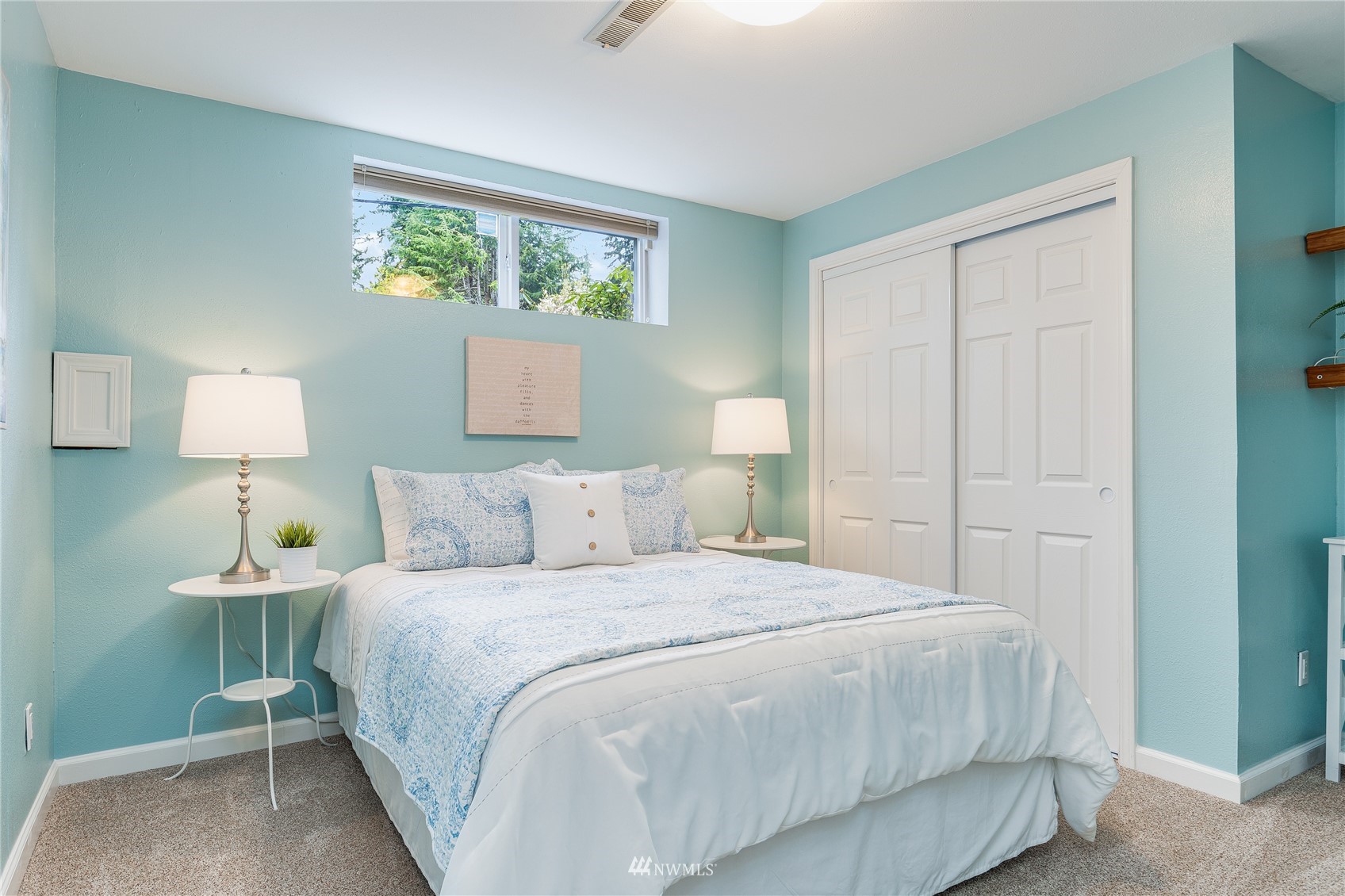 504 240th Street Southwest Bothell, WA 98021 - Photo 24 of 40 a bedroom with a bed and a lamp