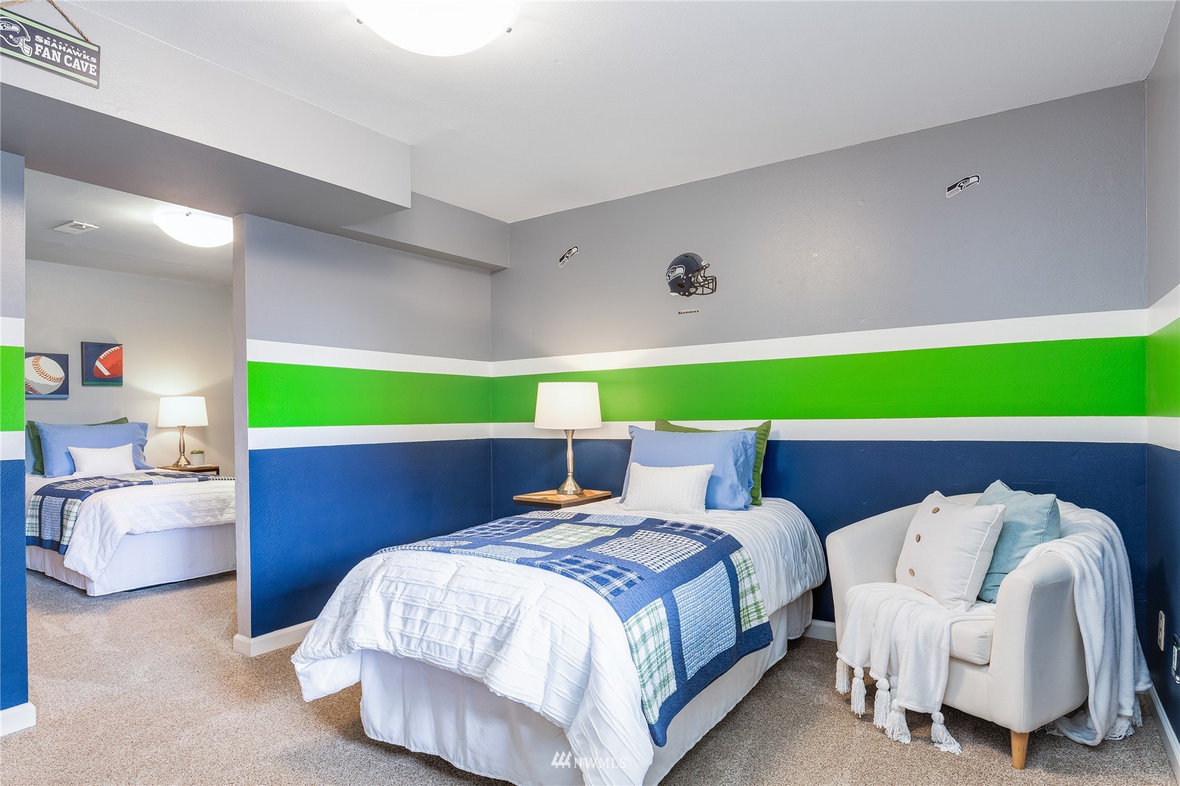 504 240th Street Southwest Bothell, WA 98021 - Photo 26 of 40 a bedroom with a bed and a chair